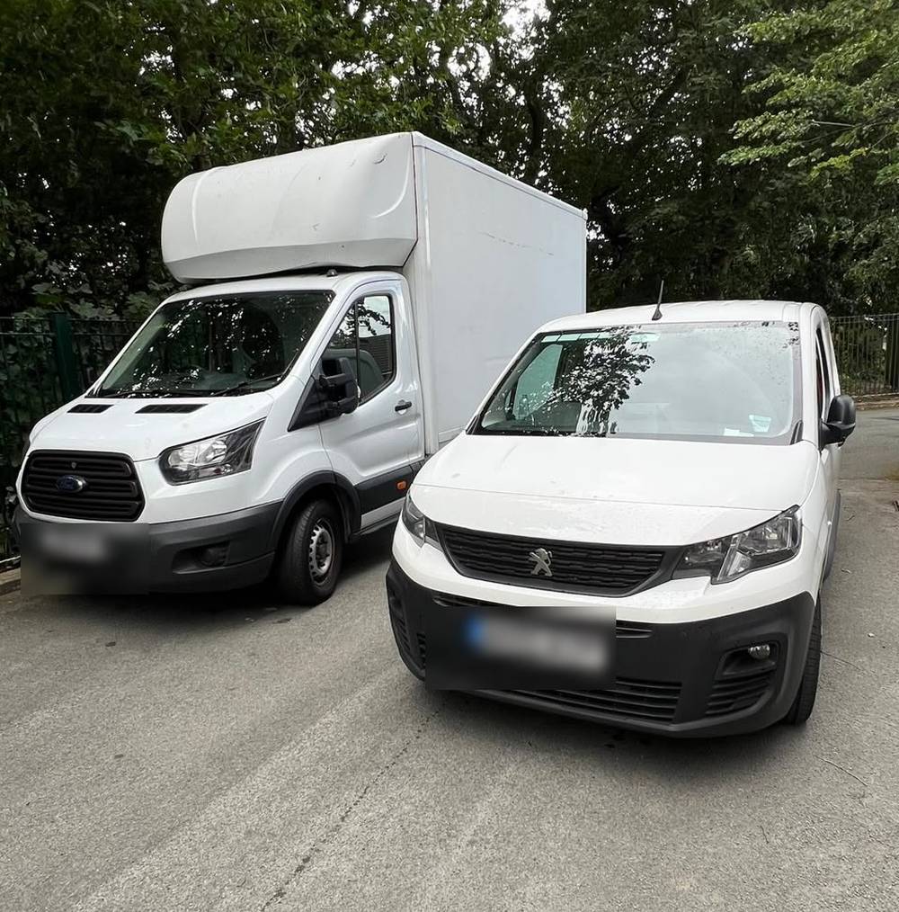 The 24/7 Reliable Jo fleet — a Luton box van and a panel van, ready to work in Manchester