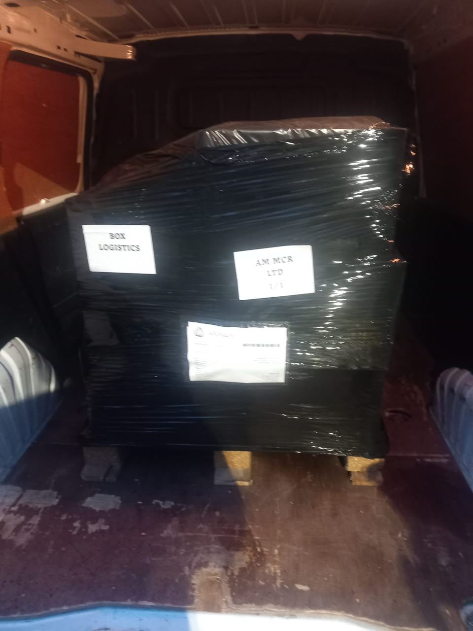 Box van loaded with drum kit, PA speakers and staging truss