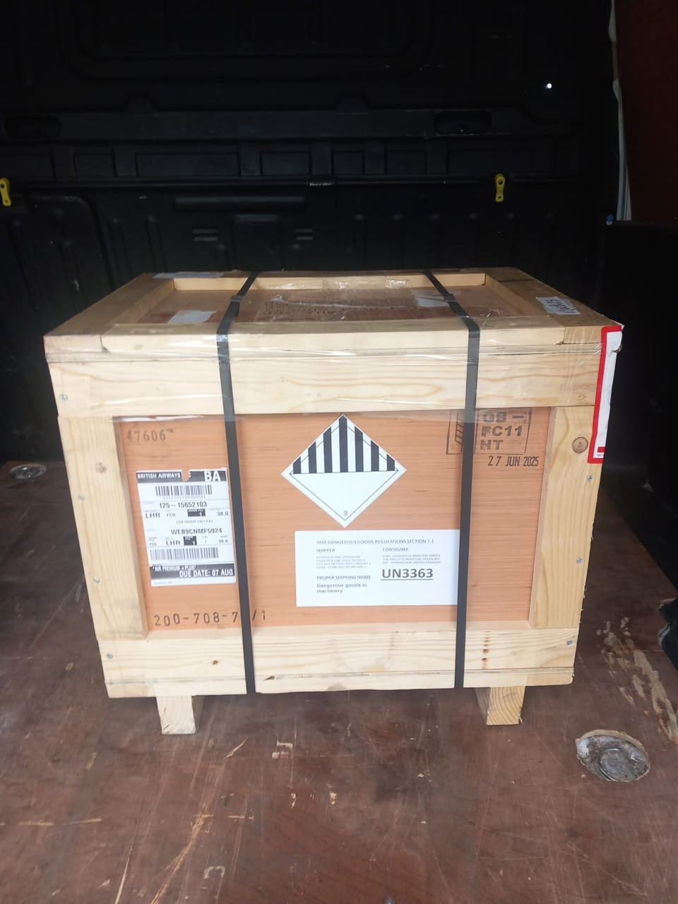 Wooden crate containing an aerospace part in a van