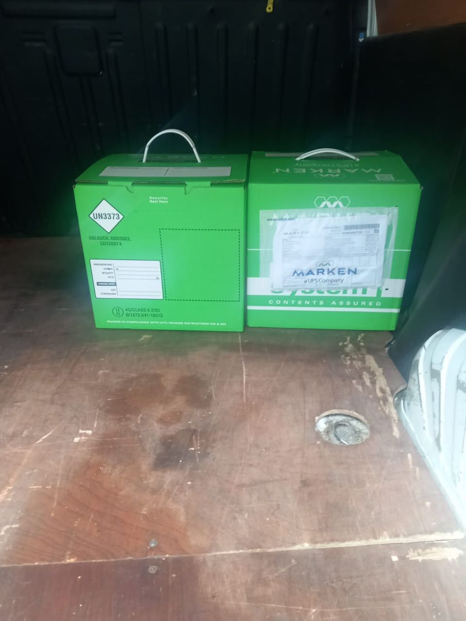 Forklift loading a wrapped pallet of boxes into a van