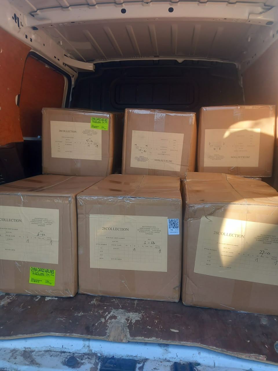 Van full of imported clothing consignment boxes