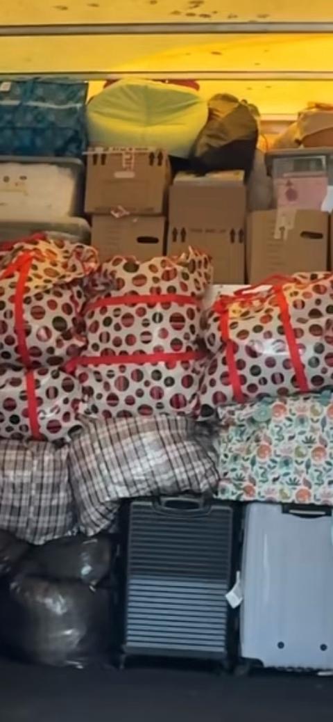 Van packed tight with bags, suitcases and boxes for a full house move